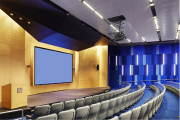 Acoustic insulation panels installed in a small theater with a screen